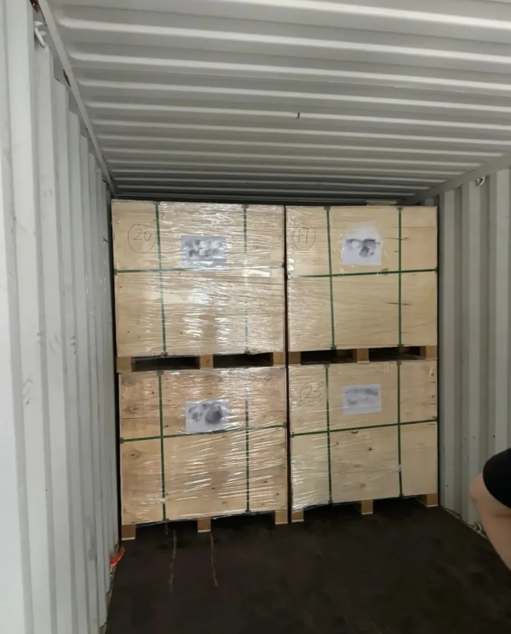 Wooden shipping crates stowed inside a container